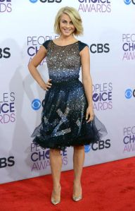 Julianne Hough made sure everyone noticed her tonight as she frocked down the red carpet in this amazing Tony Ward Couture cocktail dress. The adorable closed toe shoes are none other than Guiseppe Zanotti and the short hair is definitely working in her favor. It’s nice to see Hough in a more covered up dress, as it’s a change up from her normal flesh flashing costumes on “Dancing with the Stars”.